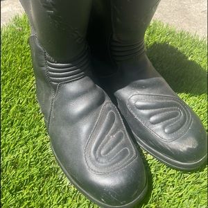 All black alpinestars motorcycle riding boots